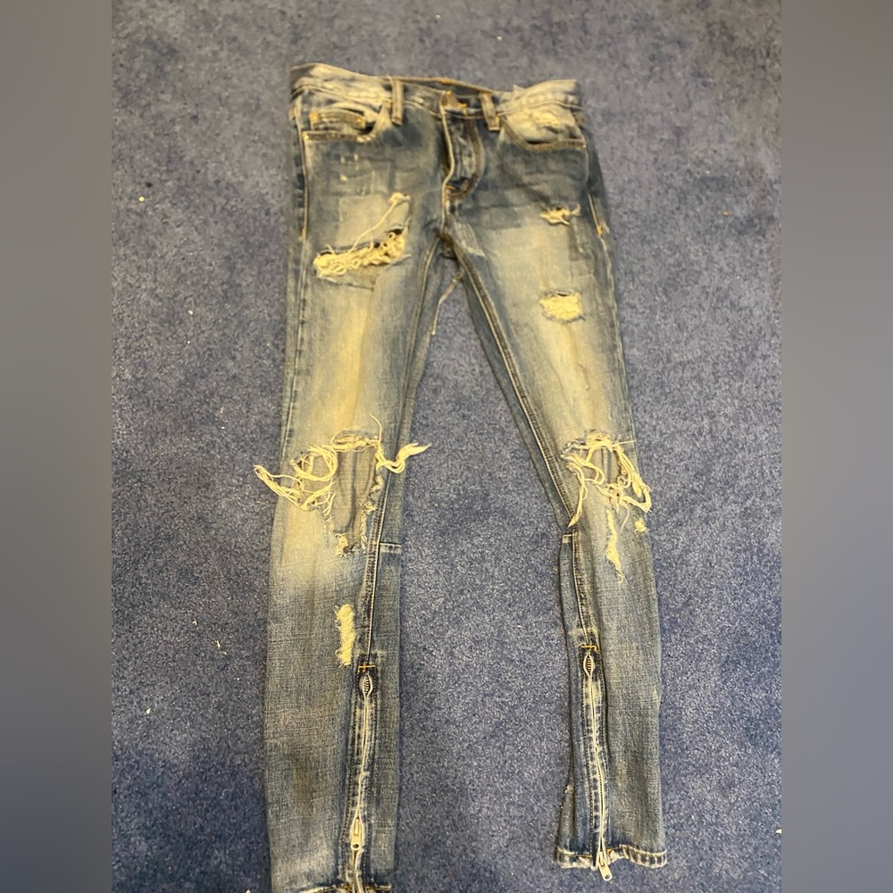 These jeans are blue and ripped you can’t wait to see how youll look in them